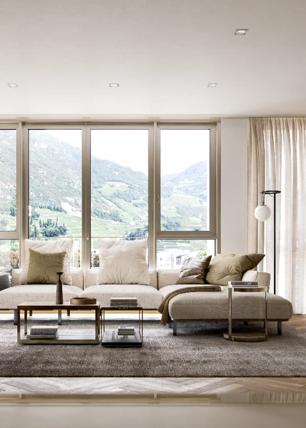 Elegant living room with mountain view and modern decor.
